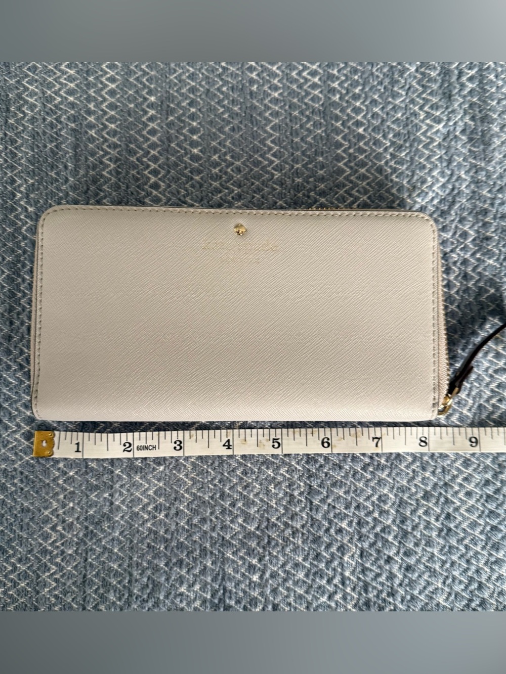 Kate Spade gray zip-around saffiano leather wallet with gold logo